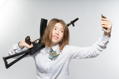 Girl with Kalashnikov makes selfie clipart