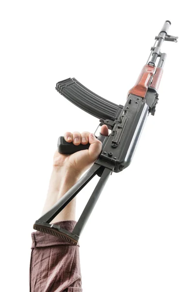 Kalashnikov levantado por uma mão — Fotografia de Stock