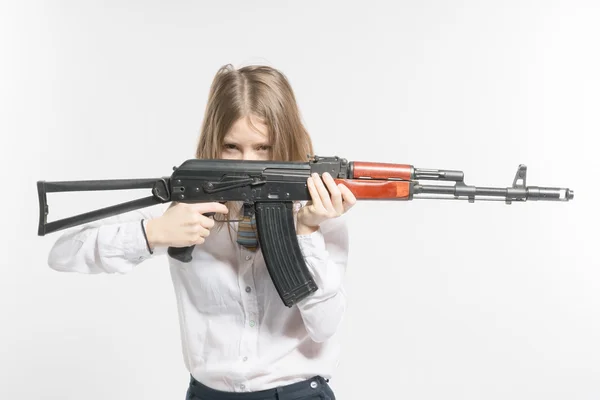 Girl holding Kalashnikov — Stock Photo, Image