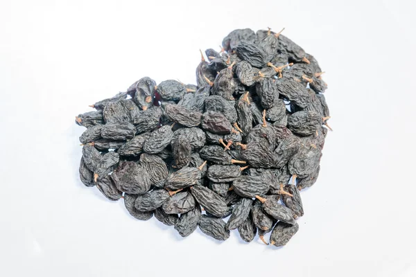 Raisins in heart shape — Stock Photo, Image