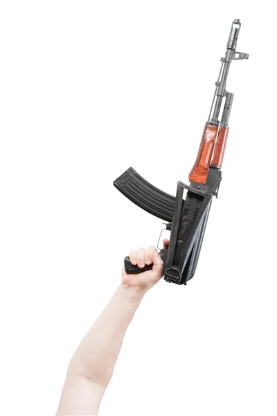 Kalashnikov raised by one hand — Stock Photo, Image