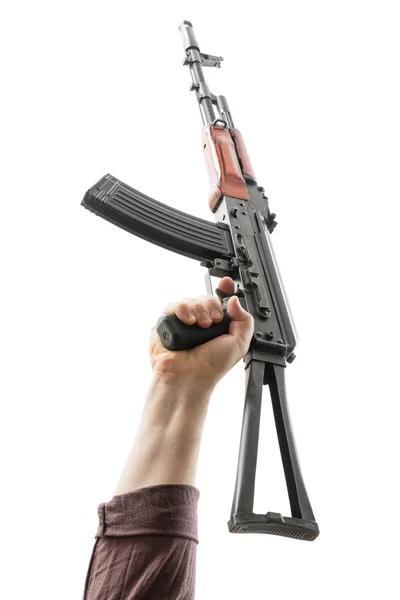 Kalashnikov raised by one hand — Stock Photo, Image