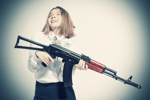 Girl smiling with Kalashnikov — Stock Photo, Image