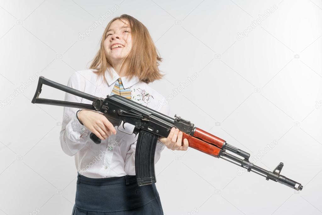 Girl smiling with Kalashnikov
