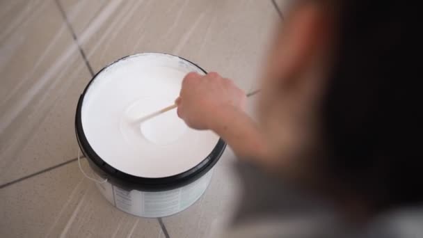 Girl Stirring Stick White Paint Bucket Frame — Stock Video