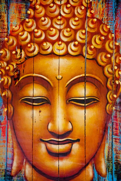 Buddha face painted on wooden planks — Stock Photo, Image