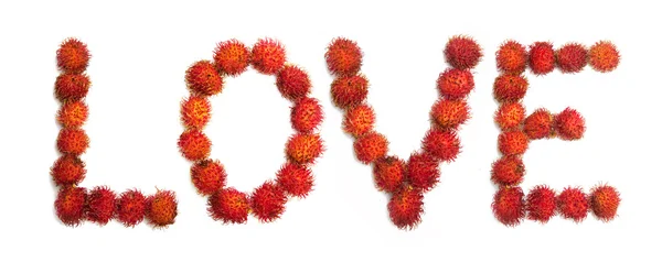 "Amor "palavra feita de rambutans — Fotografia de Stock