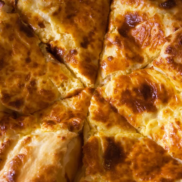 Cheese-pie cut into pieces — Stock Photo, Image