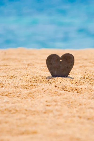 Handmade stone in sand — Stock Photo, Image