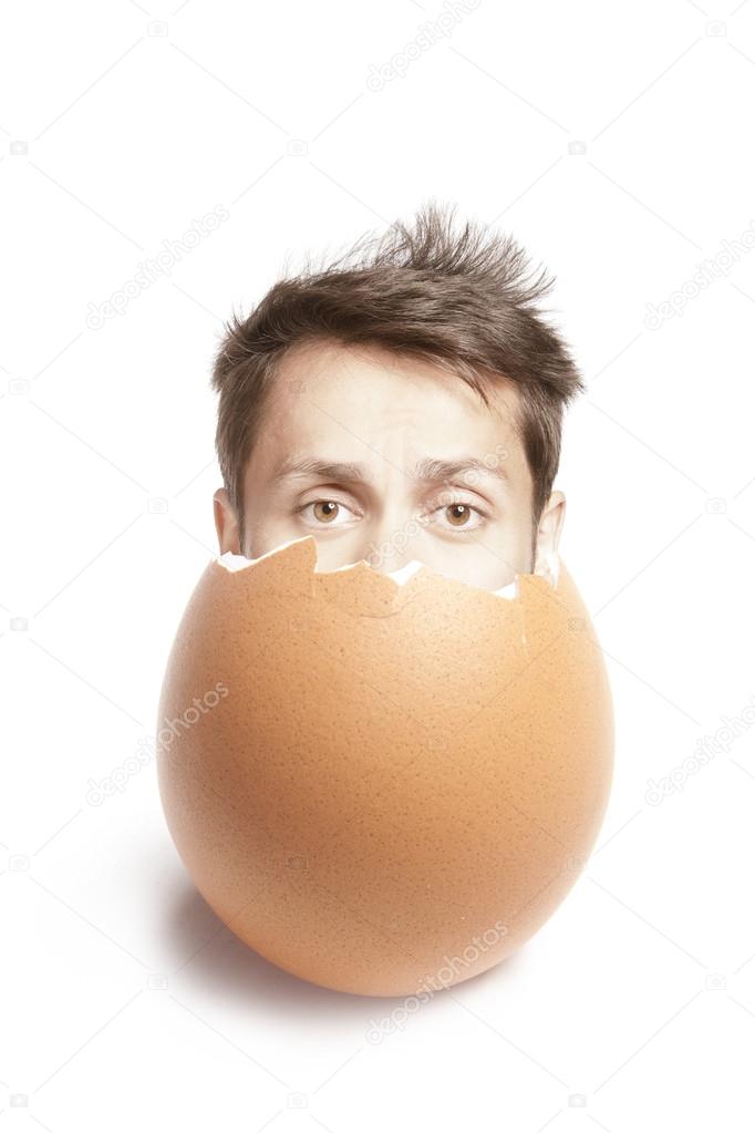 Broken egg on white