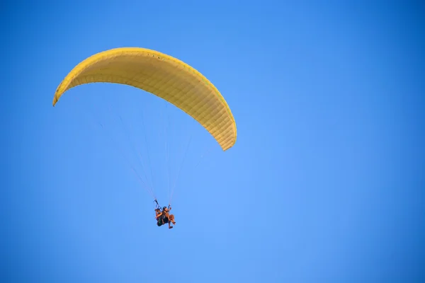 Flying with the paraglide Stock Picture