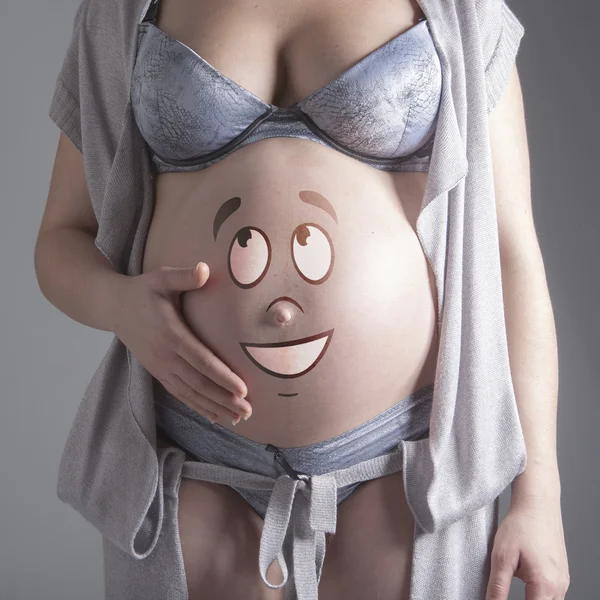 Pregnant woman shows the image — Stock Photo, Image