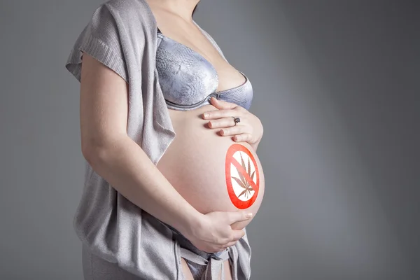 Pregnant woman with sign — Stock Photo, Image