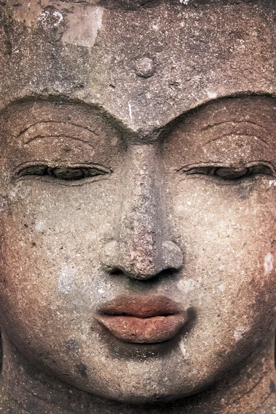 Cara de buda de pedra — Fotografia de Stock