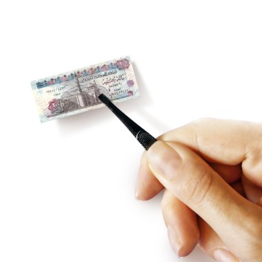 hand with a pincet holding small banknote clipart