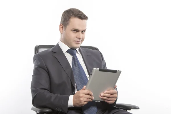 Man in a jacket sitting on a chair — Stock Photo, Image