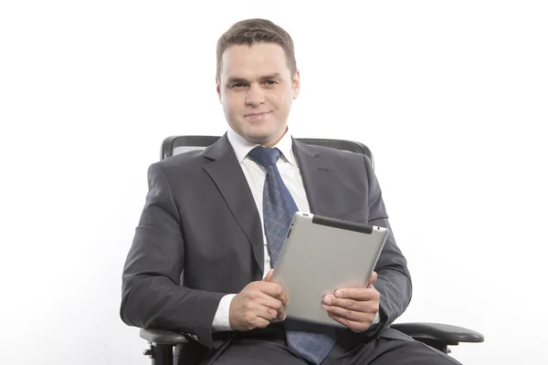 Man in a jacket sitting on a chair — Stock Photo, Image