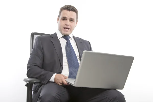 Man in a jacket holding laptop — Stock Photo, Image