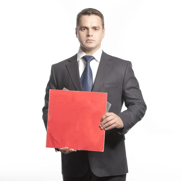 Man in a jacket holding red plate — Stock Photo, Image