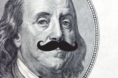 Face on dollar bill with mustache