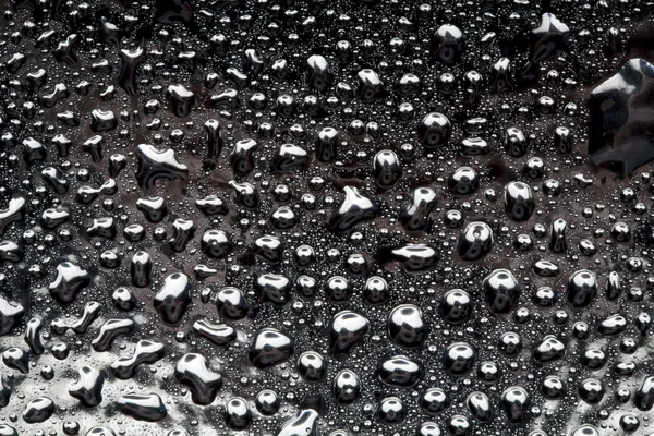 Water drops on polished metal surface — Stockfoto