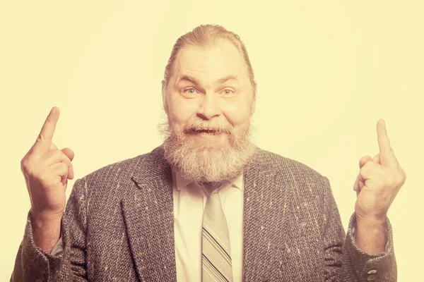 Bearded man in grey jacket shows "Fuck off" sign — Stock Photo, Image