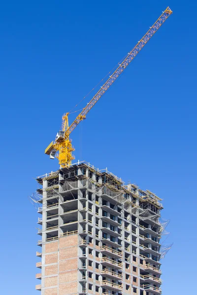 Skyscraper  under construction with crane — Stock Photo, Image