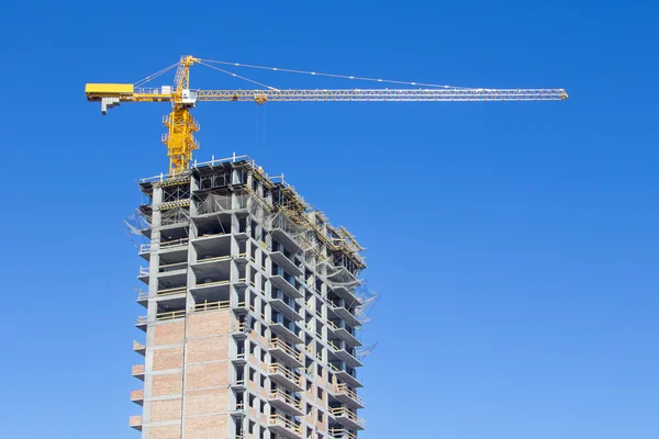 Skyscraper  under construction with crane — Stock Photo, Image