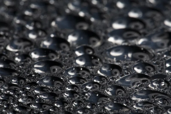 Water drops on polished metal surface — Stock fotografie