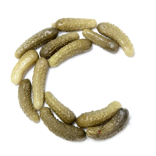 Pickled cucumbers laying in circle — Stock Fotó