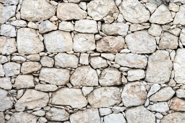 Starý šedý kámen zeď textura — Stock fotografie