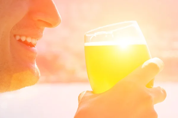 Young man enjoying frosty beer — Stock Photo, Image
