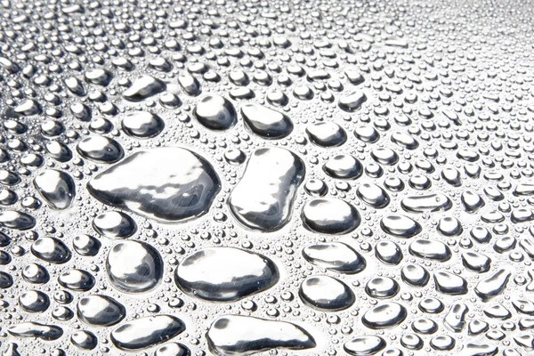 Gotas de agua en la superficie de metal pulido —  Fotos de Stock