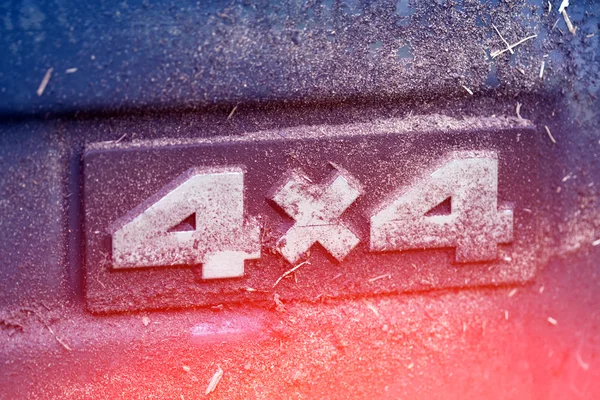 Dirty label of four-wheel drive — Stock Photo, Image