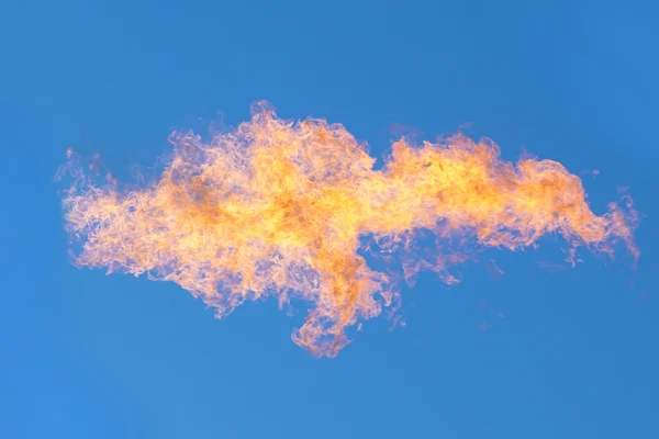 Flames against the blue sky — Stock Photo, Image