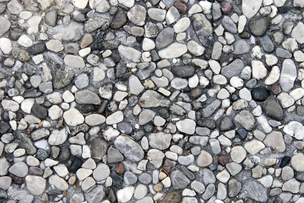 Väggen textur med vittrade stenar — Stockfoto
