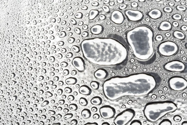 Water drops on polished metal surface — Stockfoto