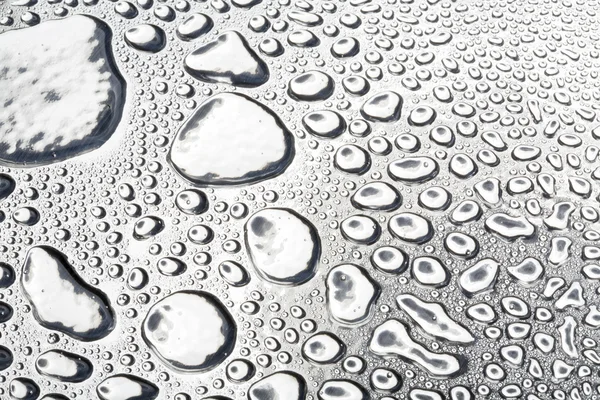 Water drops on polished metal surface — Stockfoto