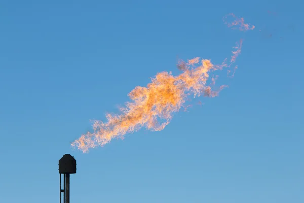 Black gas pipe with fire flames — Stock Photo, Image