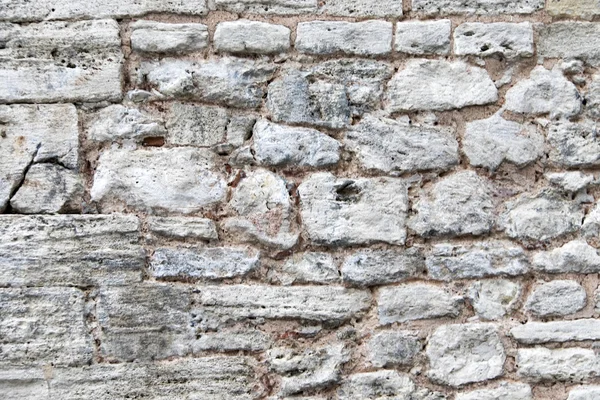 Текстура старой серой каменной стены — стоковое фото