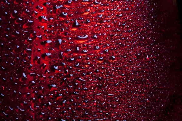 Water drops on red metal surface — 图库照片