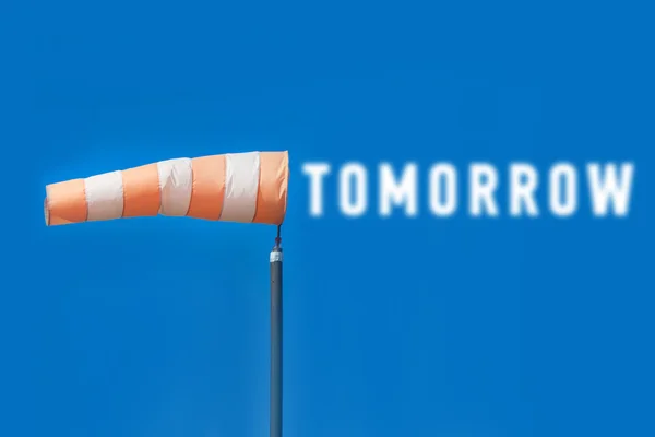 Striped airsock with tomorrow inscription — Stock Photo, Image