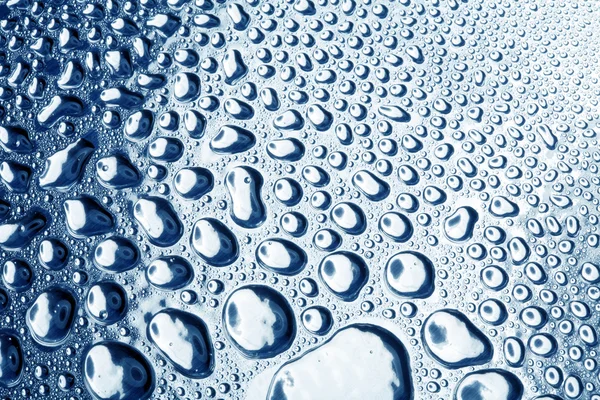 Water drops on polished metal surface — Stock Fotó