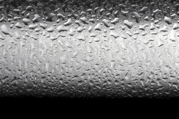 Wassertropfen auf polierter Metalloberfläche — Stockfoto