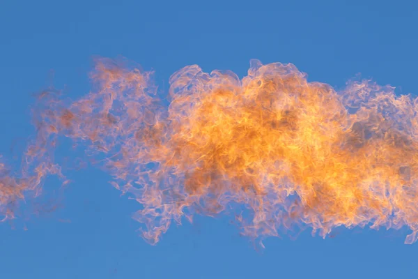 Flames against the blue sky — Zdjęcie stockowe