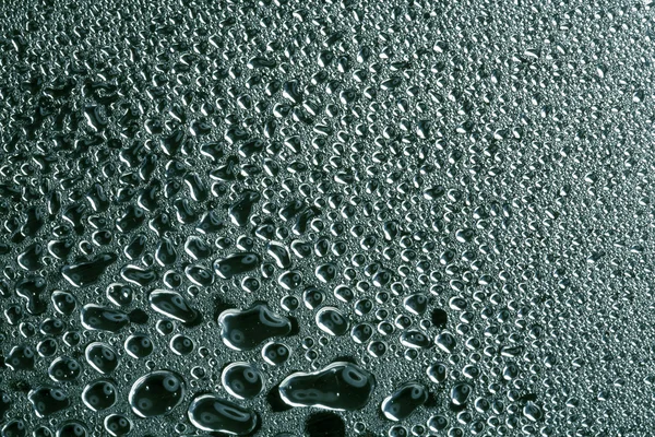 Water drops on polished metal surface — Stockfoto