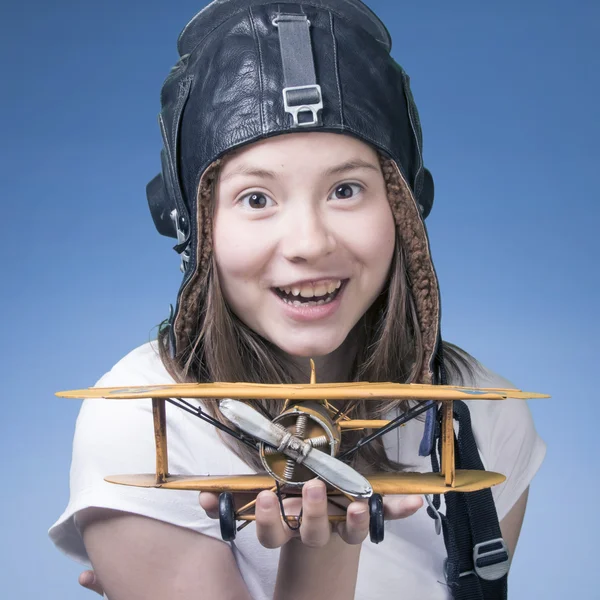 Cute young girl with airplane model — Stock Photo, Image