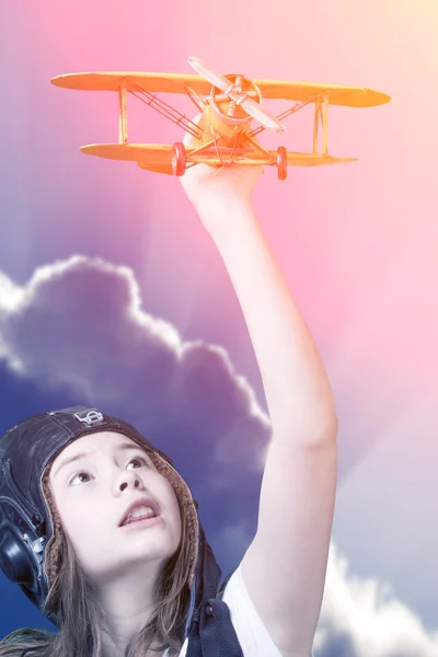 Cute young girl with airplane model — Stock Photo, Image