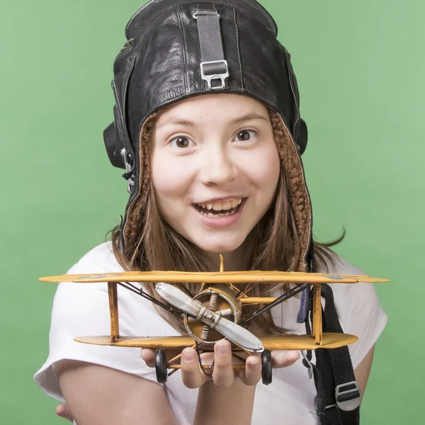 Cute young girl with airplane model — Stock Photo, Image