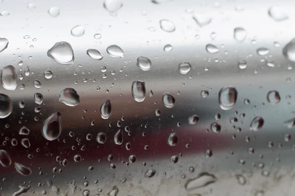 Drops of water on metal surface